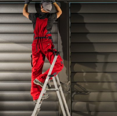 Aluminium Pergola with Wall Shade Shutters Installation Performed by Caucasian Technician